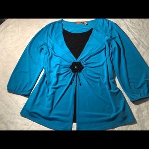 Teal blue and black top